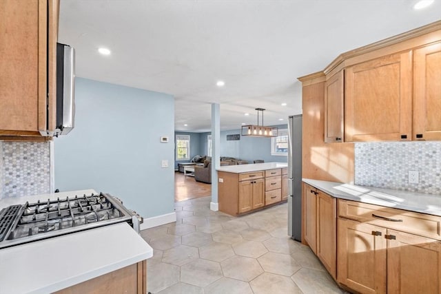 12 Babson St, Wakefield, MA 01880 - kitchen with light countertops, open floor plan, light tile patterned floors, tasteful backsplash, and recessed lighting