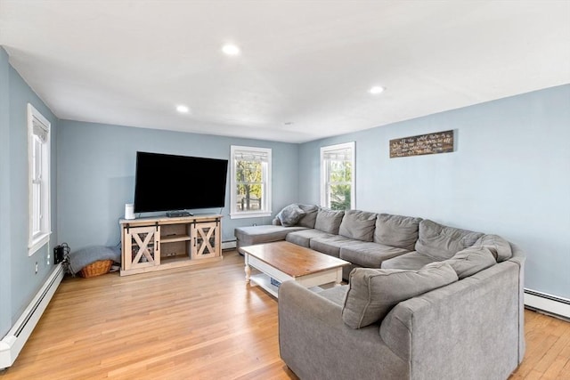 12 Babson St, Wakefield, MA 01880 - living area with a baseboard radiator, light wood finished floors, recessed lighting, and a baseboard heating unit