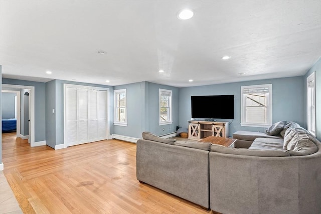 12 Babson St, Wakefield, MA 01880 - living room featuring recessed lighting, light wood-type flooring, and a baseboard heating unit