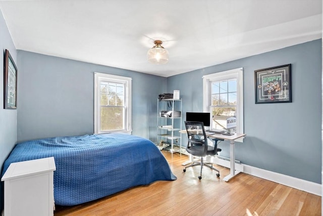 12 Babson St, Wakefield, MA 01880 - bedroom featuring multiple windows, wood finished floors, and an office area