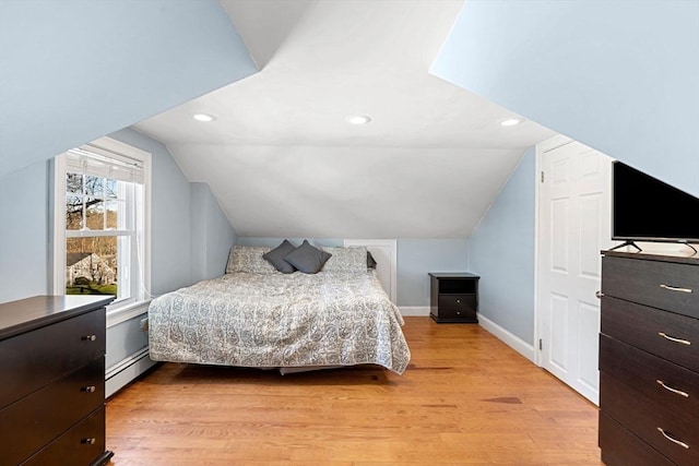 12 Babson St, Wakefield, MA 01880 - bedroom with baseboard heating, vaulted ceiling, light wood-style floors, and recessed lighting