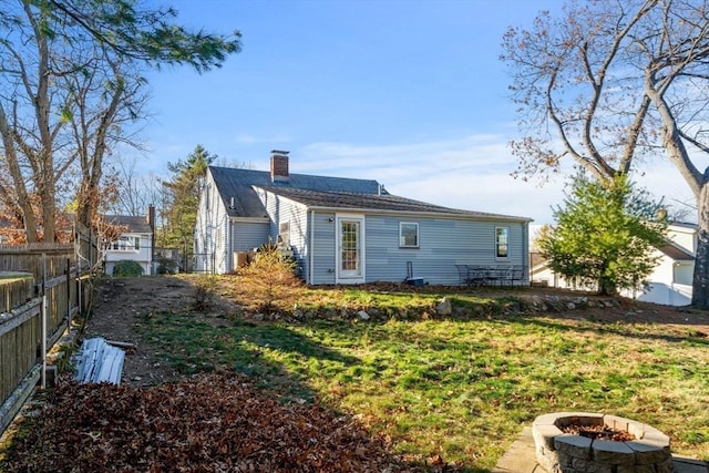 12 Babson St, Wakefield, MA 01880 - rear view of house with a fire pit and a chimney