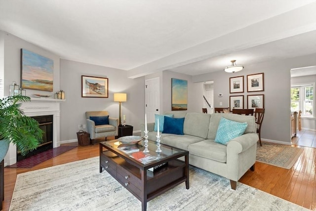 25 Valiant Way Unit 25, Salem, MA 01970 - living room with wood finished floors, baseboards, and a fireplace with flush hearth
