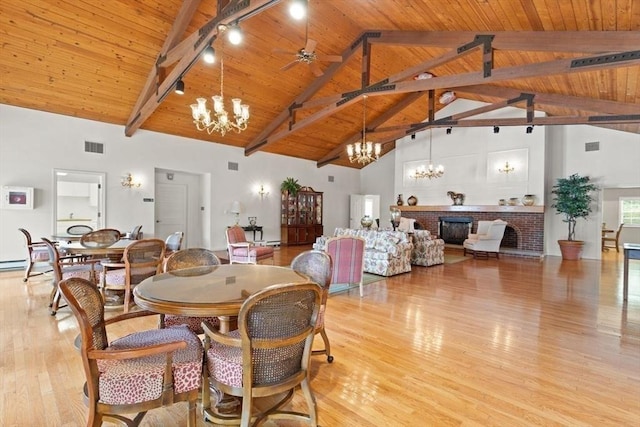 25 Valiant Way Unit 25, Salem, MA 01970 - dining area featuring a chandelier, light wood finished floors, high vaulted ceiling, wood ceiling with exposed beams, and rail lighting