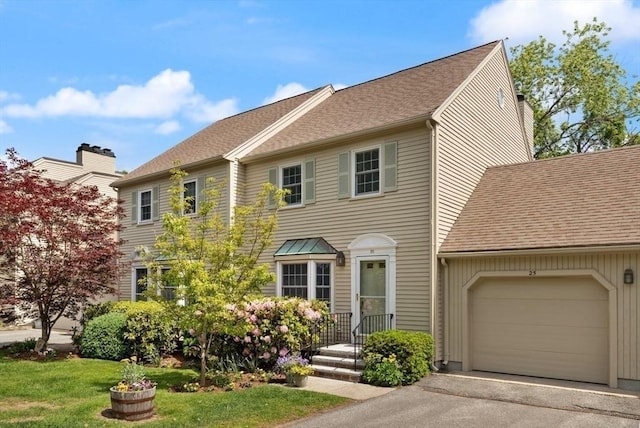 25 Valiant Way Unit 25, Salem, MA 01970 - view of front of home with an attached garage, driveway, roof with shingles, and a front lawn