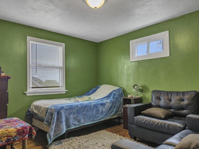 bedroom with wood finished floors