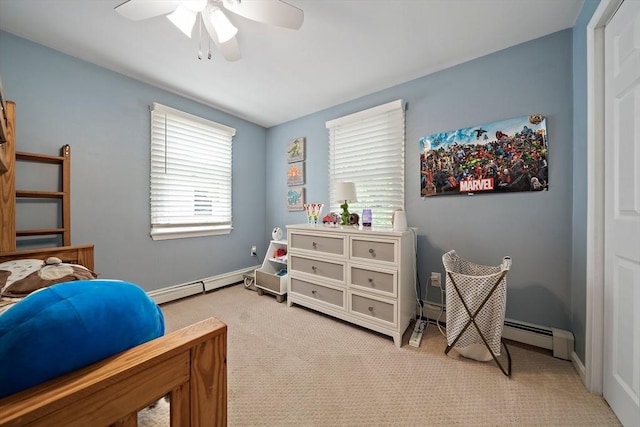 bedroom with baseboards, ceiling fan, light carpet, and baseboard heating