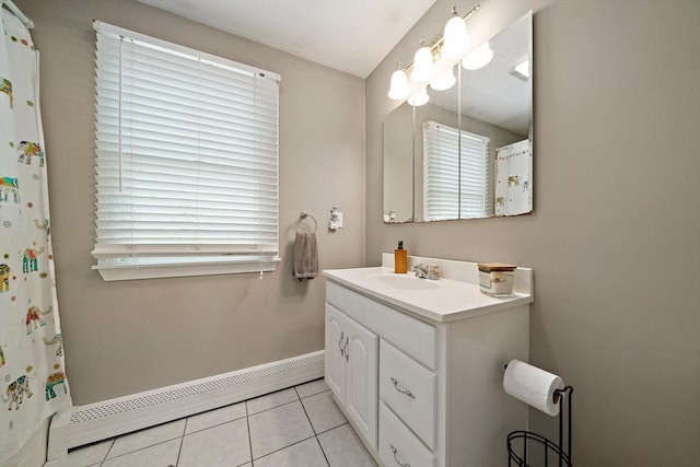 bathroom with baseboards, tile patterned flooring, baseboard heating, and vanity