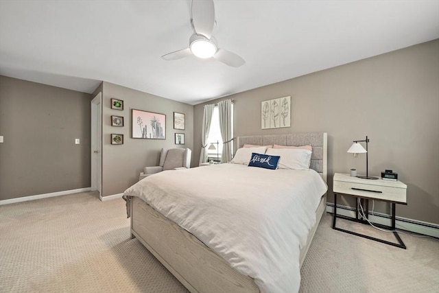 bedroom featuring light colored carpet, a baseboard radiator, baseboards, and a ceiling fan