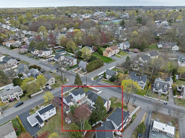 birds eye view of property with a residential view