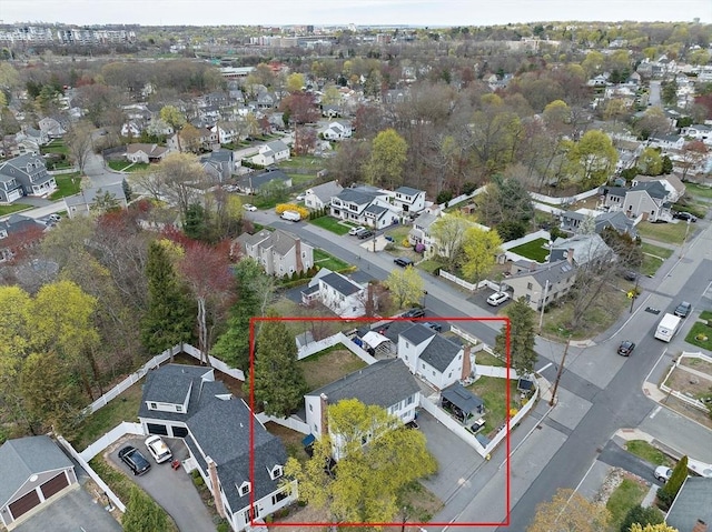 birds eye view of property with a residential view