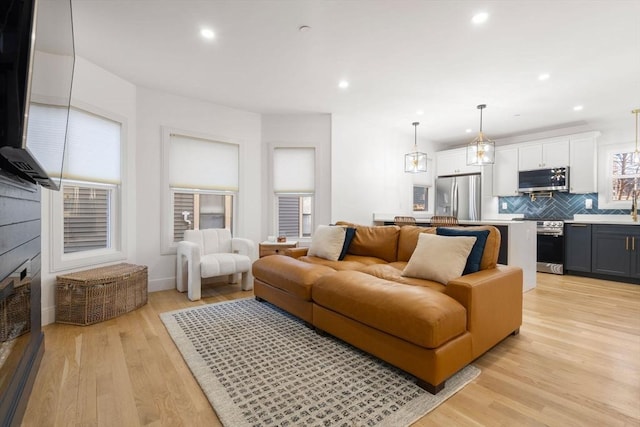 living room with light hardwood / wood-style flooring