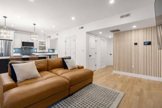 living room with light hardwood / wood-style floors