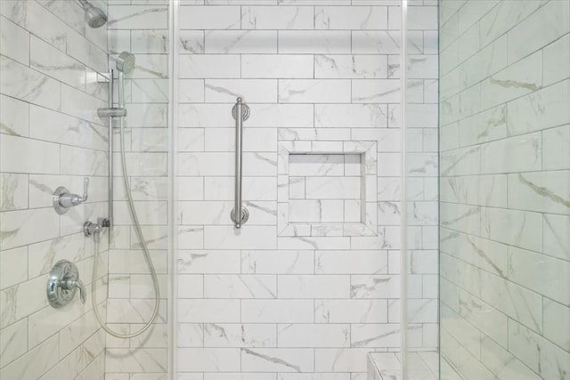 full bath featuring tiled shower