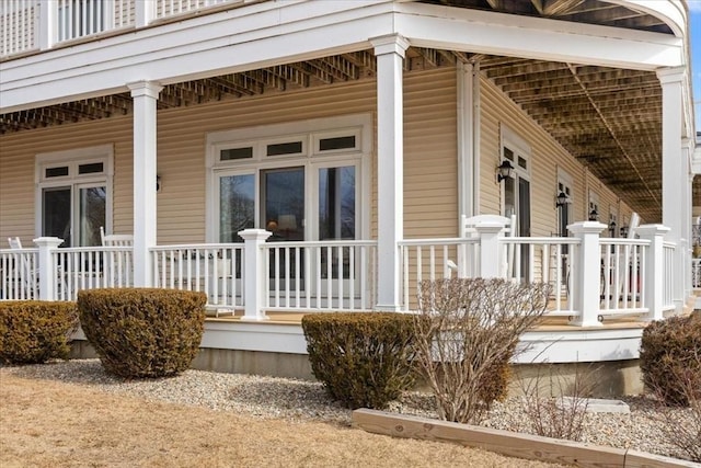 view of property exterior featuring covered porch