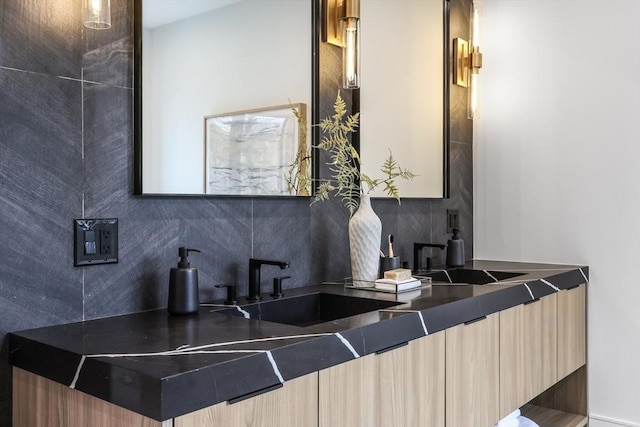 bathroom featuring backsplash and vanity