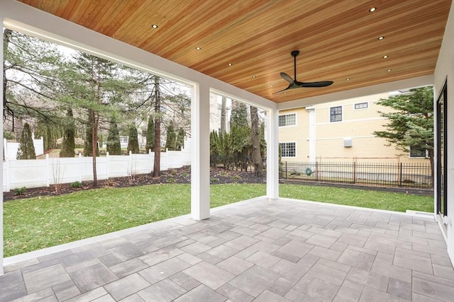 unfurnished sunroom with wood ceiling and ceiling fan