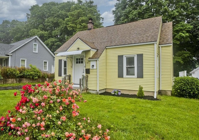 24 City View Ave, West Springfield, MA 01089 - view of front facade with a front lawn, a chimney, and roof with shingles