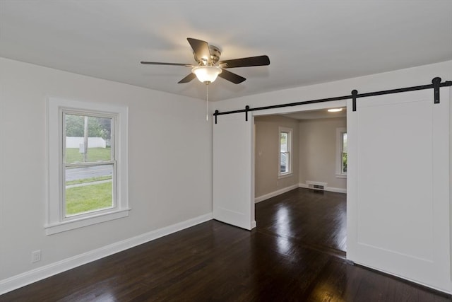 24 City View Ave, West Springfield, MA 01089 - spare room featuring a barn door, plenty of natural light, and ceiling fan