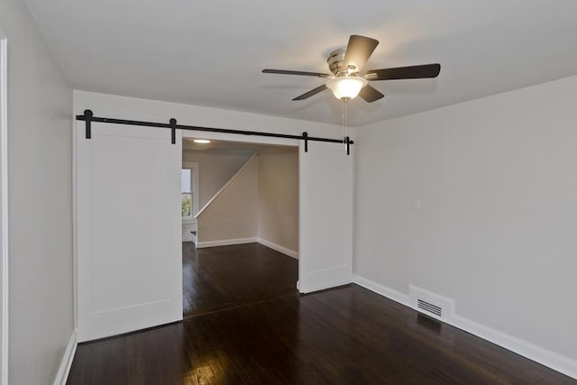 24 City View Ave, West Springfield, MA 01089 - unfurnished room featuring a barn door, a ceiling fan, and wood finished floors