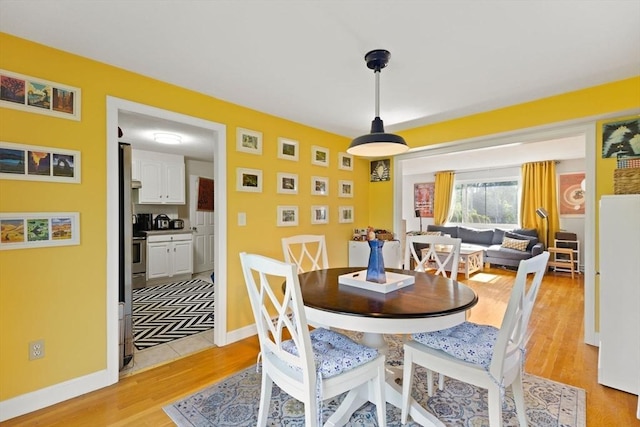 212 Washington St Unit 212, Canton, MA 02021 - dining room with light wood-style flooring and baseboards