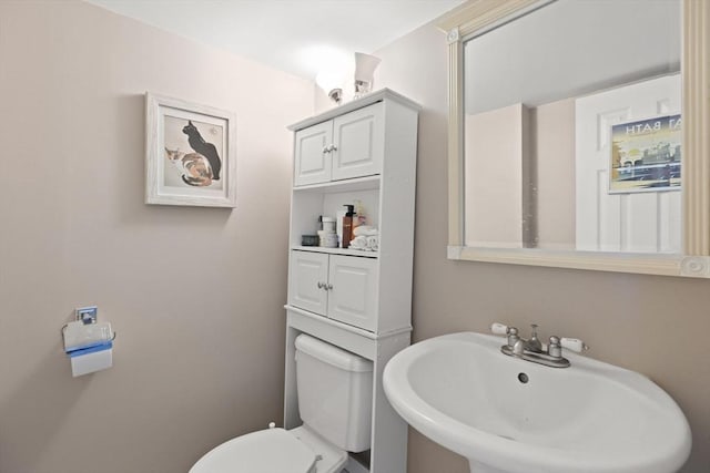 212 Washington St Unit 212, Canton, MA 02021 - half bathroom featuring a sink and toilet