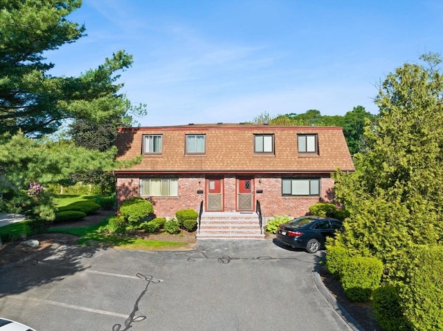 212 Washington St Unit 212, Canton, MA 02021 - view of front facade with mansard roof and brick siding