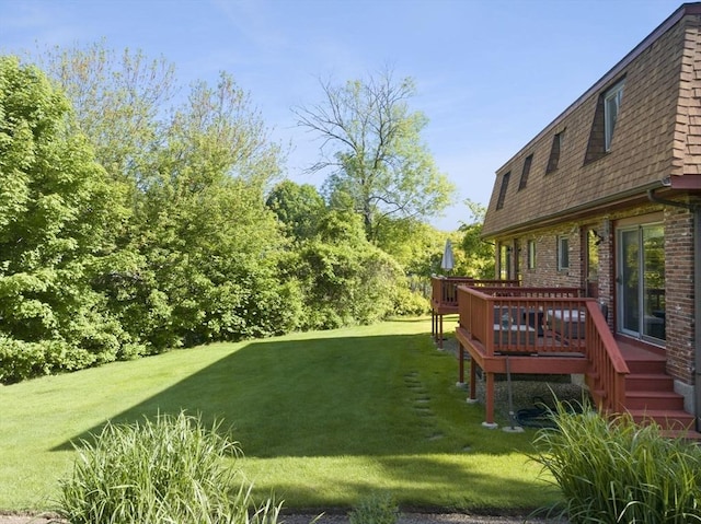 212 Washington St Unit 212, Canton, MA 02021 - view of grassy yard with a deck