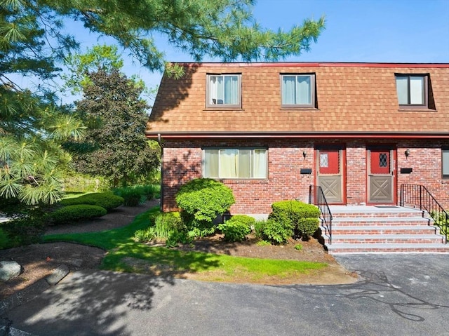 212 Washington St Unit 212, Canton, MA 02021 - view of front of house with mansard roof, a shingled roof, and brick siding