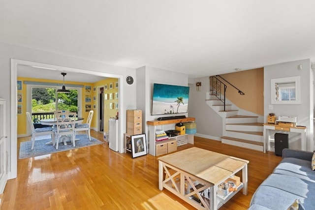 212 Washington St Unit 212, Canton, MA 02021 - living area with light wood finished floors, stairs, and baseboards
