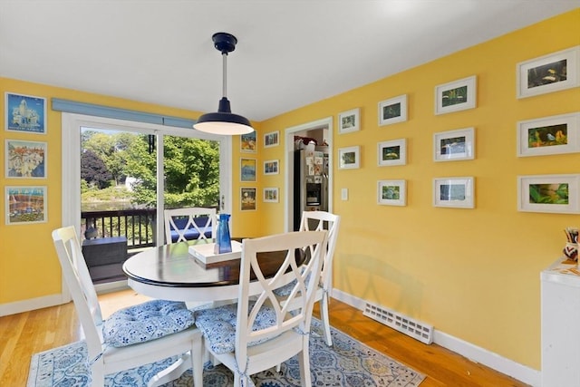 212 Washington St Unit 212, Canton, MA 02021 - dining room with light wood-style flooring and baseboards