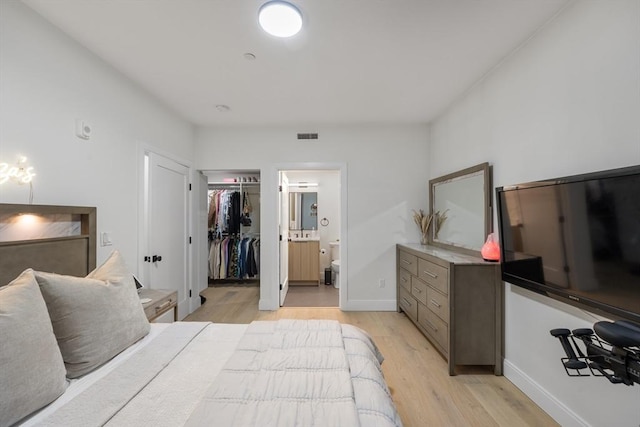 101 Condor St Unit 301A, Boston, MA 02128 - bedroom featuring light wood finished floors, a spacious closet, ensuite bathroom, baseboards, and a closet