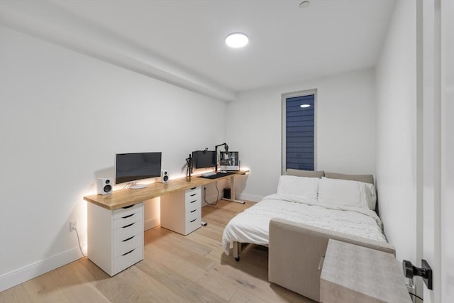 101 Condor St Unit 301A, Boston, MA 02128 - bedroom featuring light wood finished floors, baseboards, and an office area