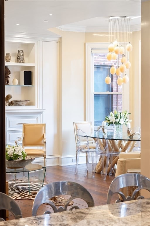 interior space featuring crown molding and dark hardwood / wood-style flooring