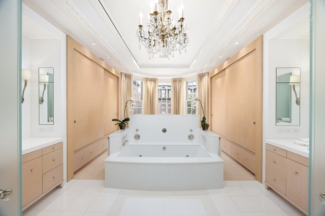 bathroom featuring tiled tub, vanity, tile patterned flooring, a tray ceiling, and ornamental molding