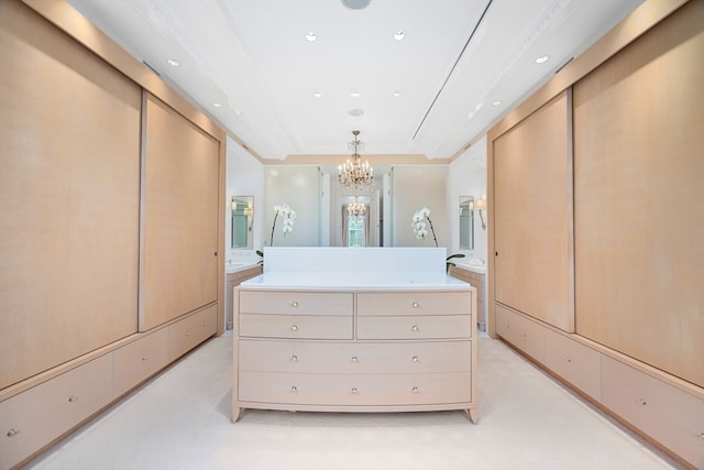 walk in closet featuring a chandelier