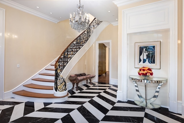 entrance foyer featuring ornamental molding and a notable chandelier