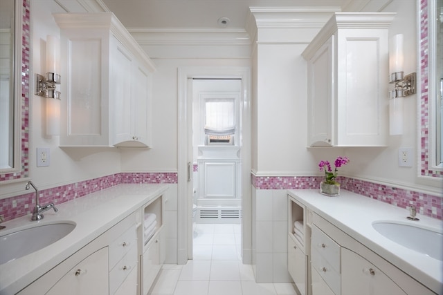 bathroom featuring ornamental molding, tile patterned flooring, and vanity