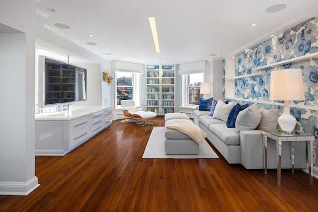 living room with crown molding and dark wood-type flooring