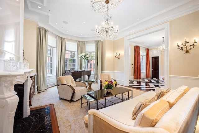 living room featuring an inviting chandelier and crown molding