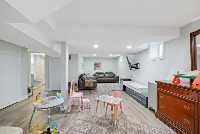 living area featuring recessed lighting and light wood-style flooring