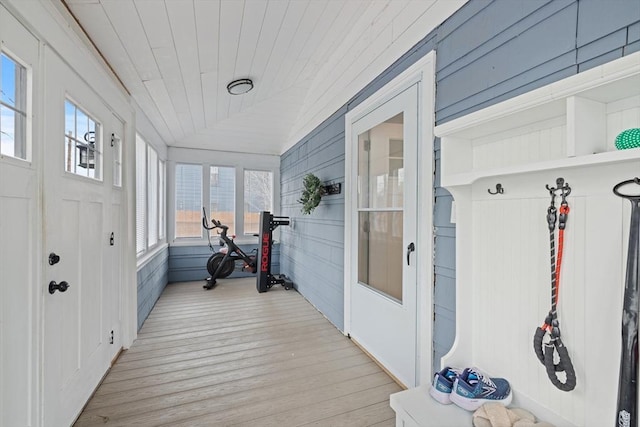 interior space with lofted ceiling, wood finished floors, and wooden ceiling