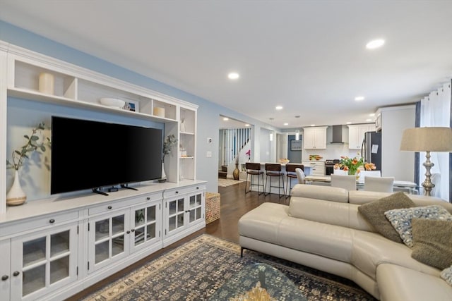 living room featuring recessed lighting and dark wood-style flooring