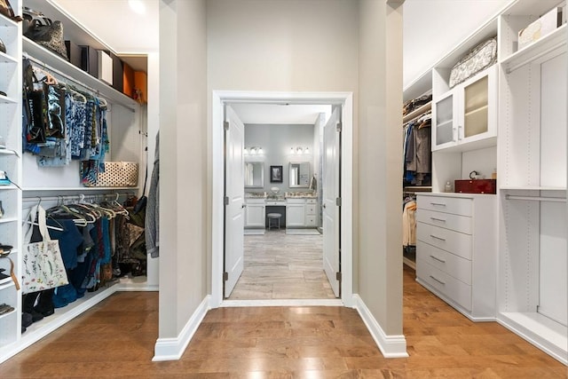 spacious closet with light wood-style flooring