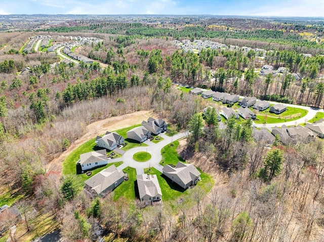 bird's eye view with a residential view and a wooded view