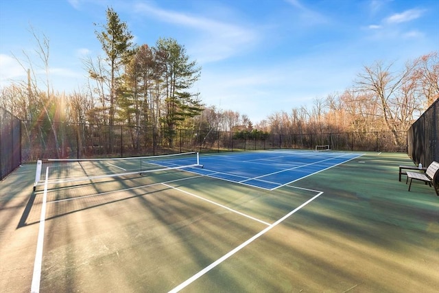 view of sport court featuring fence and community basketball court