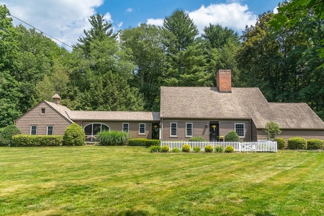 188 Main St, Wilbraham, MA 01095 - view of front of property featuring a chimney, a front lawn, and roof with shingles