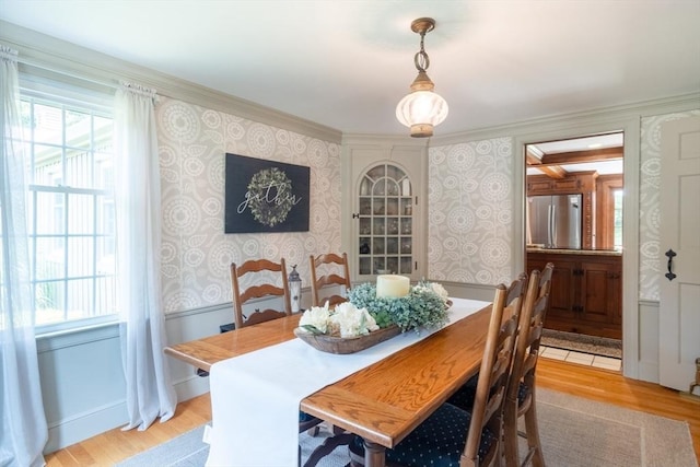 188 Main St, Wilbraham, MA 01095 - dining room with wallpapered walls, light wood-style floors, and crown molding