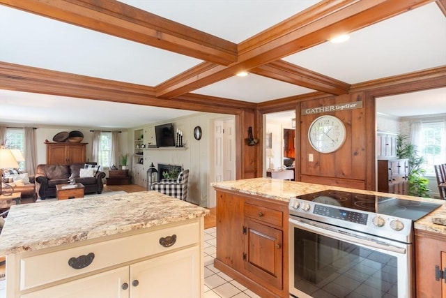 188 Main St, Wilbraham, MA 01095 - kitchen with stainless steel electric range, beamed ceiling, crown molding, light stone counters, and a fireplace