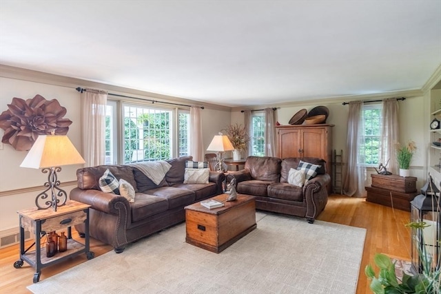 188 Main St, Wilbraham, MA 01095 - living area featuring crown molding, light wood-style floors, and plenty of natural light